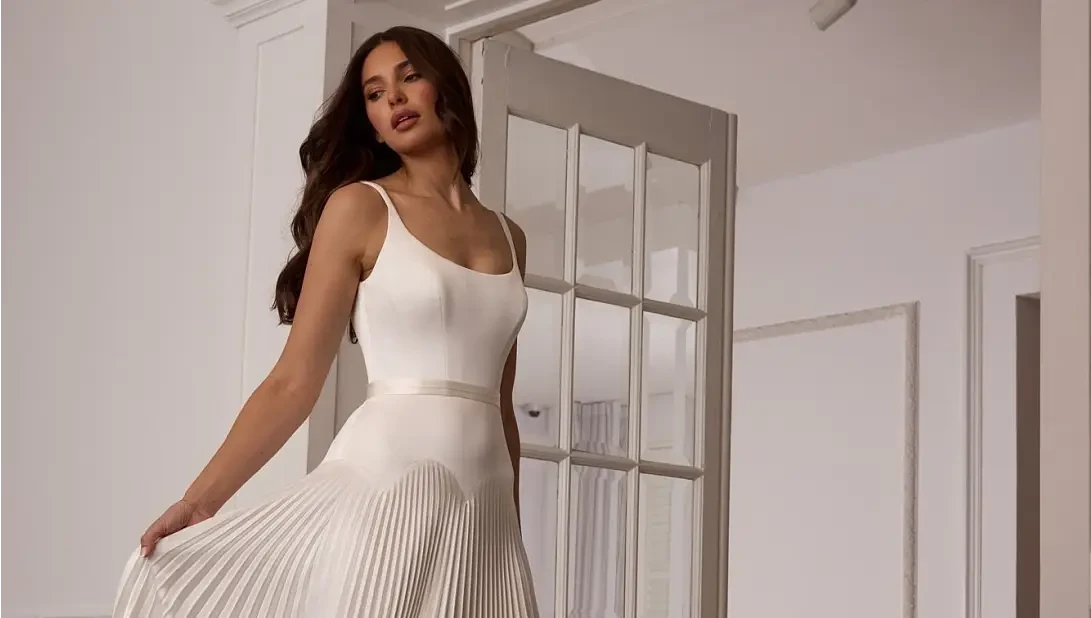 Model wearing a white gown