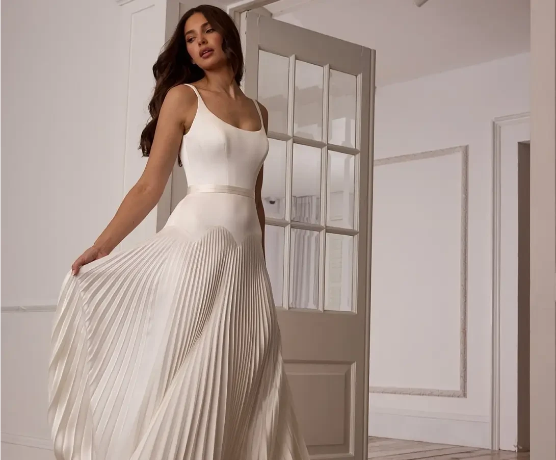 Model wearing a white gown