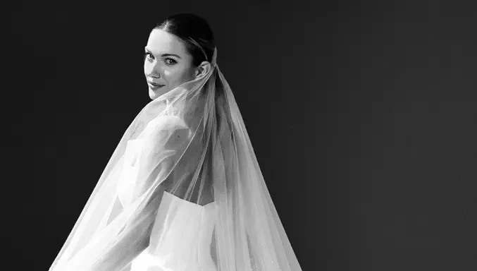 Model wearing a white gown