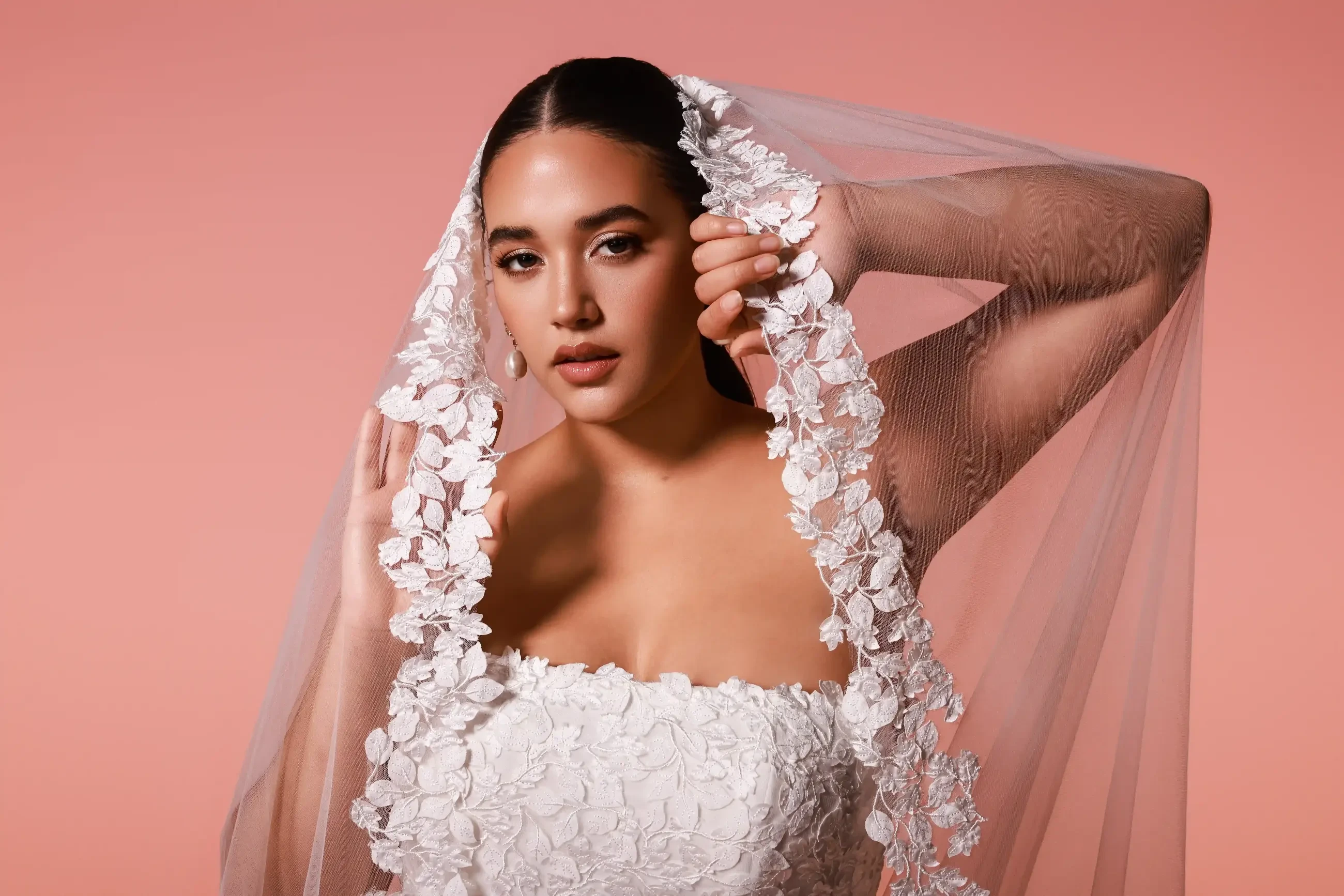 Model wearing a white gown