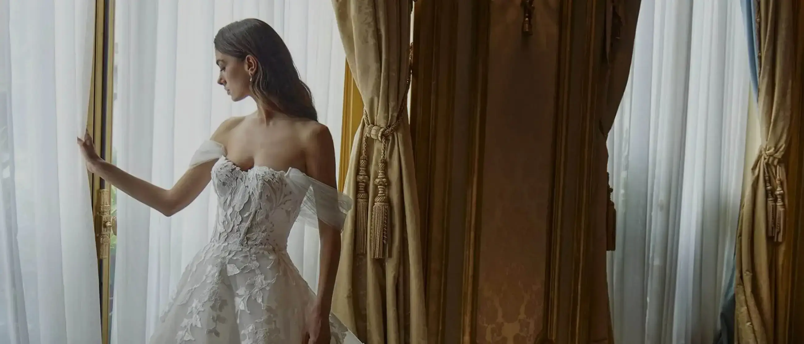 Model wearing a white gown