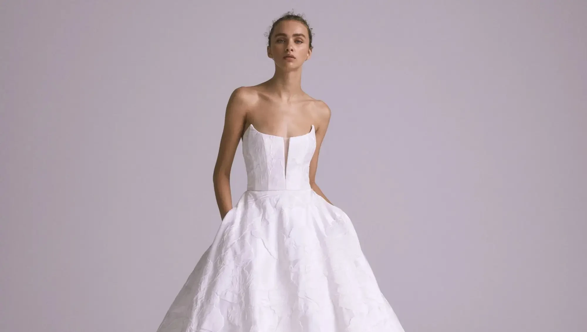 Model wearing a white gown