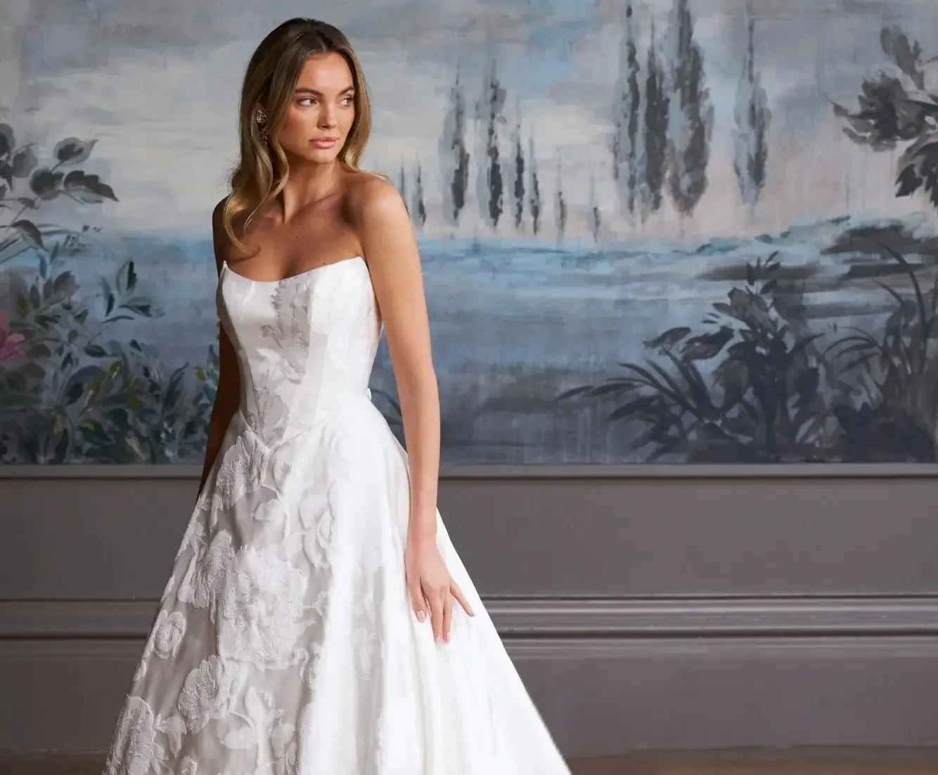 Model wearing a white gown