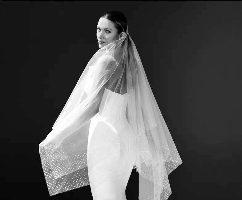 Model wearing a white gown