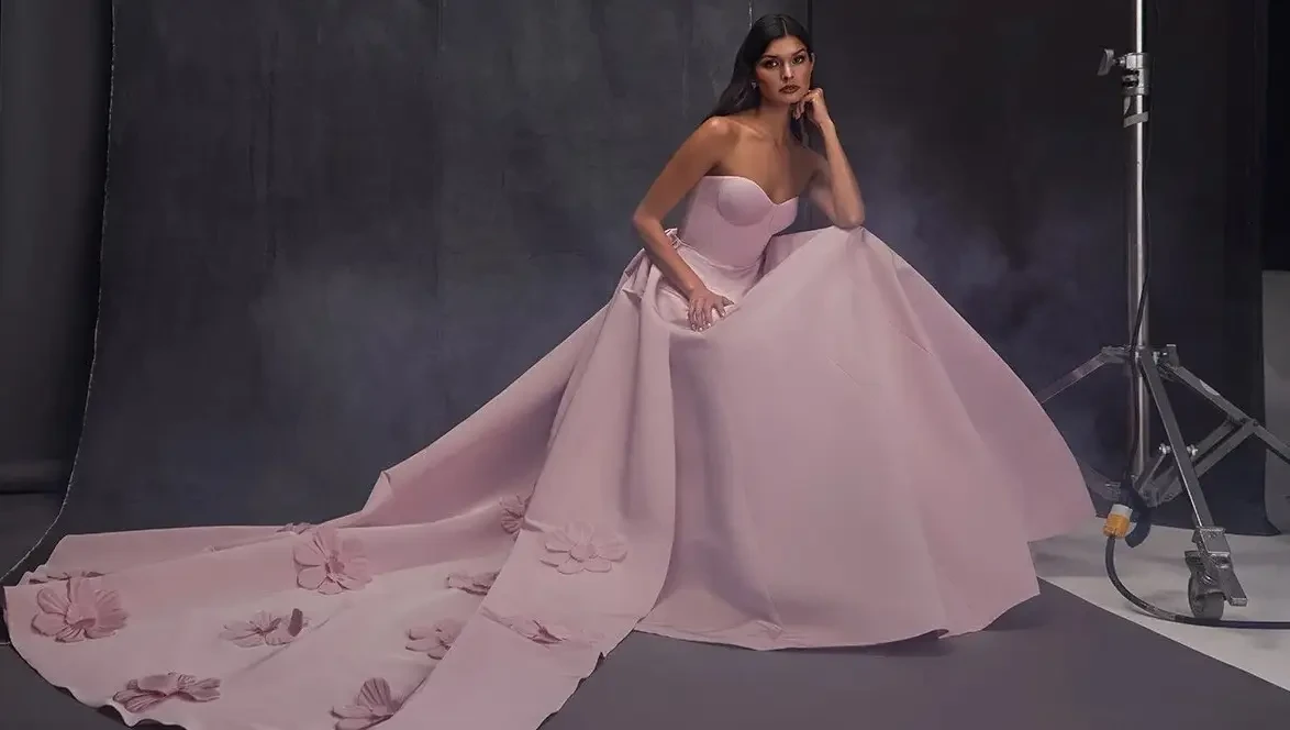 Model wearing a white gown